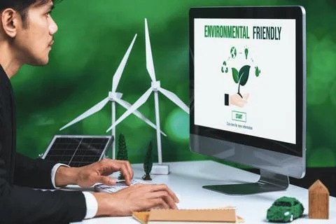 Businessman working in office developing plan on alternative energy. Gyre Stock Photos