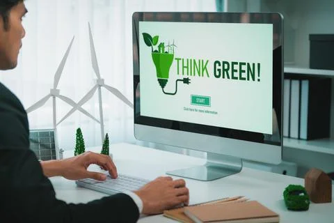 Businessman working in office developing plan on alternative energy. Gyre Stock Photos