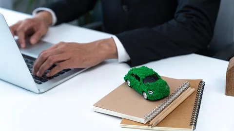Businessman working in office developing plan on ev car. Gyre Stock Photos