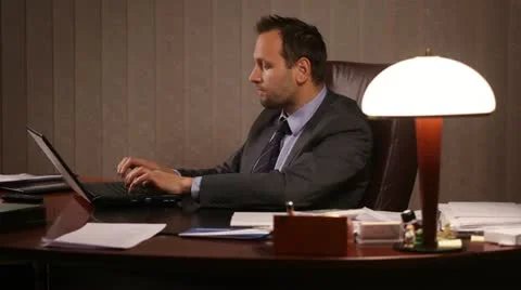 Businessman working in office Video stock 10956632