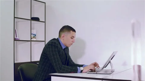 A businessman working in an office Stock Footage 66577456