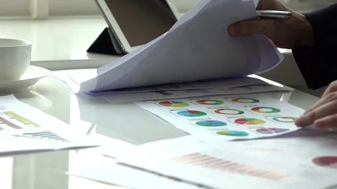 Businessman working in office with graph document Stock Footage 83161467