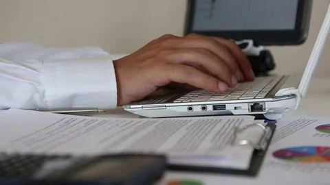 Businessman Working in the Office with Notebook Stock Footage 83777796