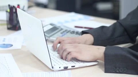 Businessman working in office using laptop Stock Footage 87085871