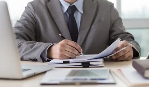 Businessman working reading documents graph financial to job succes Analyze d Stock Photos