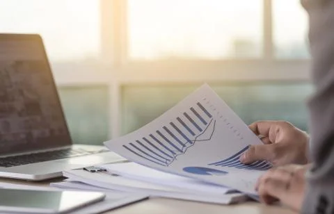 Businessman working reading documents graph financial to job succes Analyze d 스톡 사진