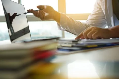 Businessman working reading documents graph financial to job succes Analyze d Stockfoto's