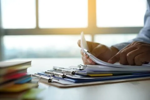 Businessman working reading documents graph financial to job succes Analyze d 库存照片