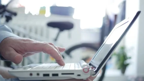 Businessman Working Remotely from Home Using Laptop and Wireless Connectivity Stock Footage 131336129