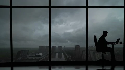 The businessman working at the table on the rainy sky background Stock Footage 135225486