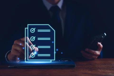 Businessman working with tablet. Checking mark up on the check boxes. Success Stock Photos