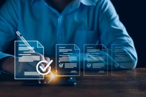 Businessman working with tablet. Checking mark up on the check boxes. Success Stock Photos