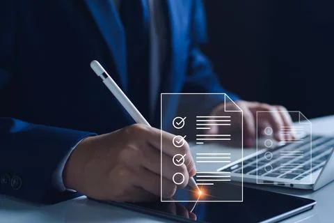 Businessman working with tablet. Checking mark up on the check boxes. Succe.. Stock Photos