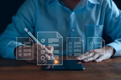 Businessman working with tablet. Checking mark up on the check boxes. Success Stock Photos