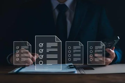 Businessman working with tablet. Checking mark up on the check boxes. Success Stock Photos