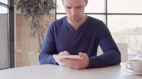 Businessman working on tablet computer and drinking coffee in cafe 스톡 동영상 73363944