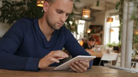 Businessman working on tablet computer in cafe Stock Footage 67862347