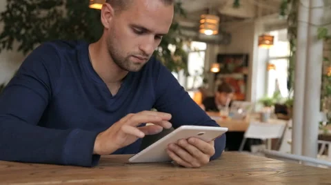 Businessman working on tablet computer in cafe Stock Footage 67862392