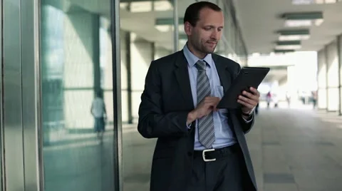 Businessman working on tablet computer in the city HD Stock Footage 11514052