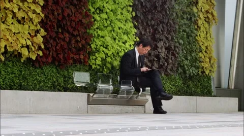 Businessman working With Tablet Computer In The Park Japan Tokyo Stock-Footage 49345052