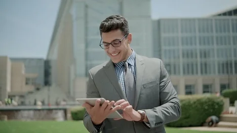 Businessman working on tablet computer by the street Stock Footage 101604196