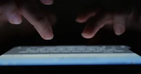 Businessman working on tablet at night, close-up Cropped Hands Typing On digi Stock Footage 228674628