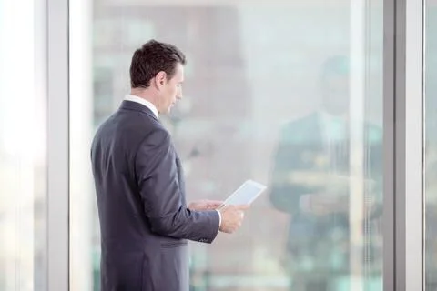 Businessman working with tablet Stock Photos