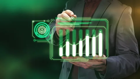 A businessman is working on a virtual tablet with data on oil production levels. Stock Footage 270242451