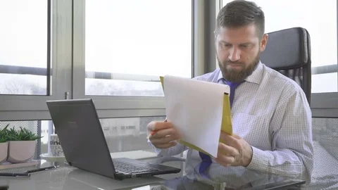 Businessman working, writing, making notes, in office 動画素材 73169425