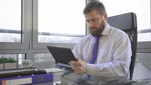 Businessman working writing on tablet computer, in office 動画素材 73169953