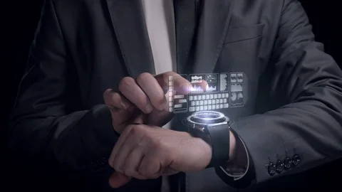 Businessman works with the clock of the future Stock Footage 122924172