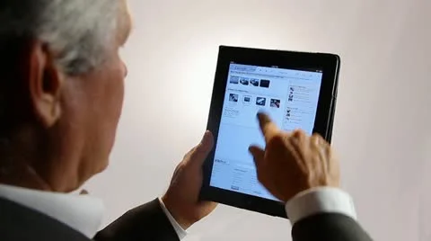 BUSINESSMAN WORKS WITH A PROGRAM ON A TABLET COMPUTER Stock Footage 12154220