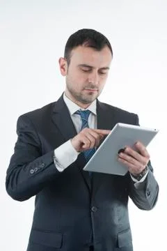 Businessman works with tablet Stockfoto's
