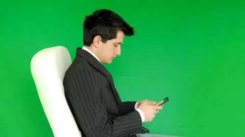 Businessman write on a cell phone Stock Footage 61263715