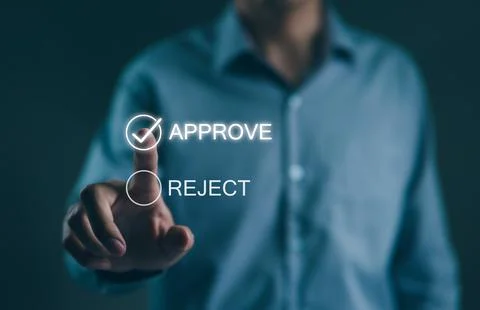 Businessman write or tick correct mark to approve document or project. Stock Photos