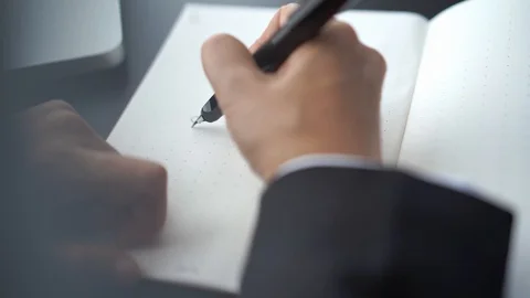 Businessman write words on notebook page, SWOT analysis concept Stock Footage 121257805