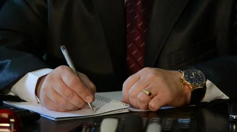Businessman writes document Stock Footage 55652530