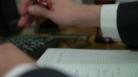 Businessman writes a report on the computer Stock Footage 68771422
