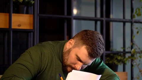 Businessman writing document in cafe. Stock Footage 126029328