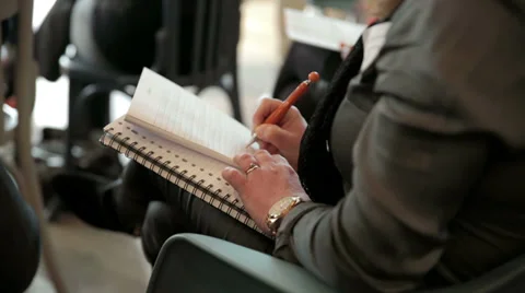 A businessman, writing in a notebook Stock Footage 37098102