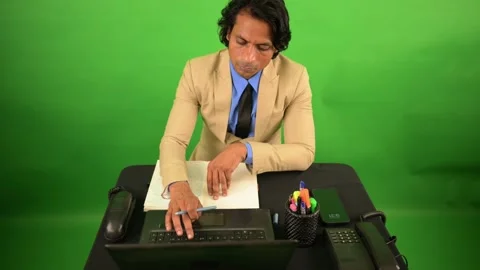 Businessman writing in notebook while checking laptop Video stock 295927277