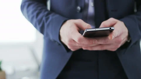 Businessman writing a text message on his mobile. Stock Footage 68399680