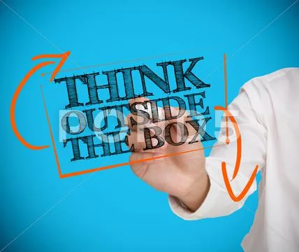 Businessman writing think outside the box with a chalk Stock Photos