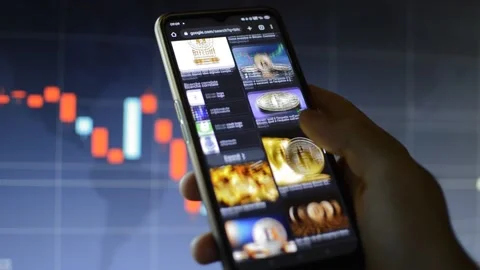 Businessman's hand scroll bitcoin cryptocurrency money on his iphone Video stock 197280538