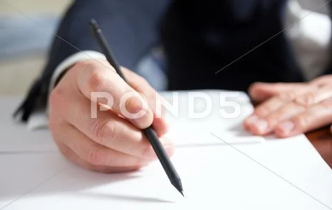 Businessman's hand signing papers. Lawyer, realtor, businessman Stock Photos