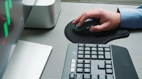 A businessman's hand uses a computer mouse. Stock Footage 232494110