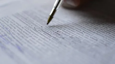Businessman's hand using pen for work on a document. Video stock 219467999