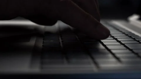 Businessman's hands work on laptop computer keyboard at office desk. Close-up. Stock Footage 212097124
