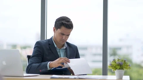 Businessmen are working in the computer-ready office and recording data Stock Footage 102252080