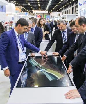 Businessmen at the big interface. Stock Photos